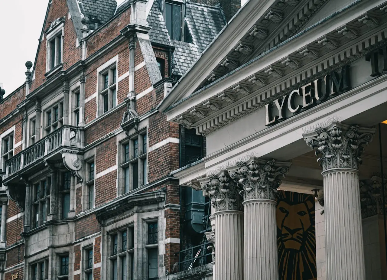 Explore the classic architecture of London's Lyceum Theatre with striking column details.